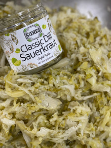 jar of classic dill sauerkraut inside a large bowl full of classic dill sauerkraut 