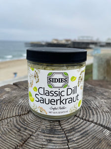 jar of classic dill sauerkraut with a beach background