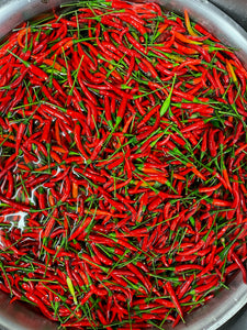 large bowl of red thai chilies